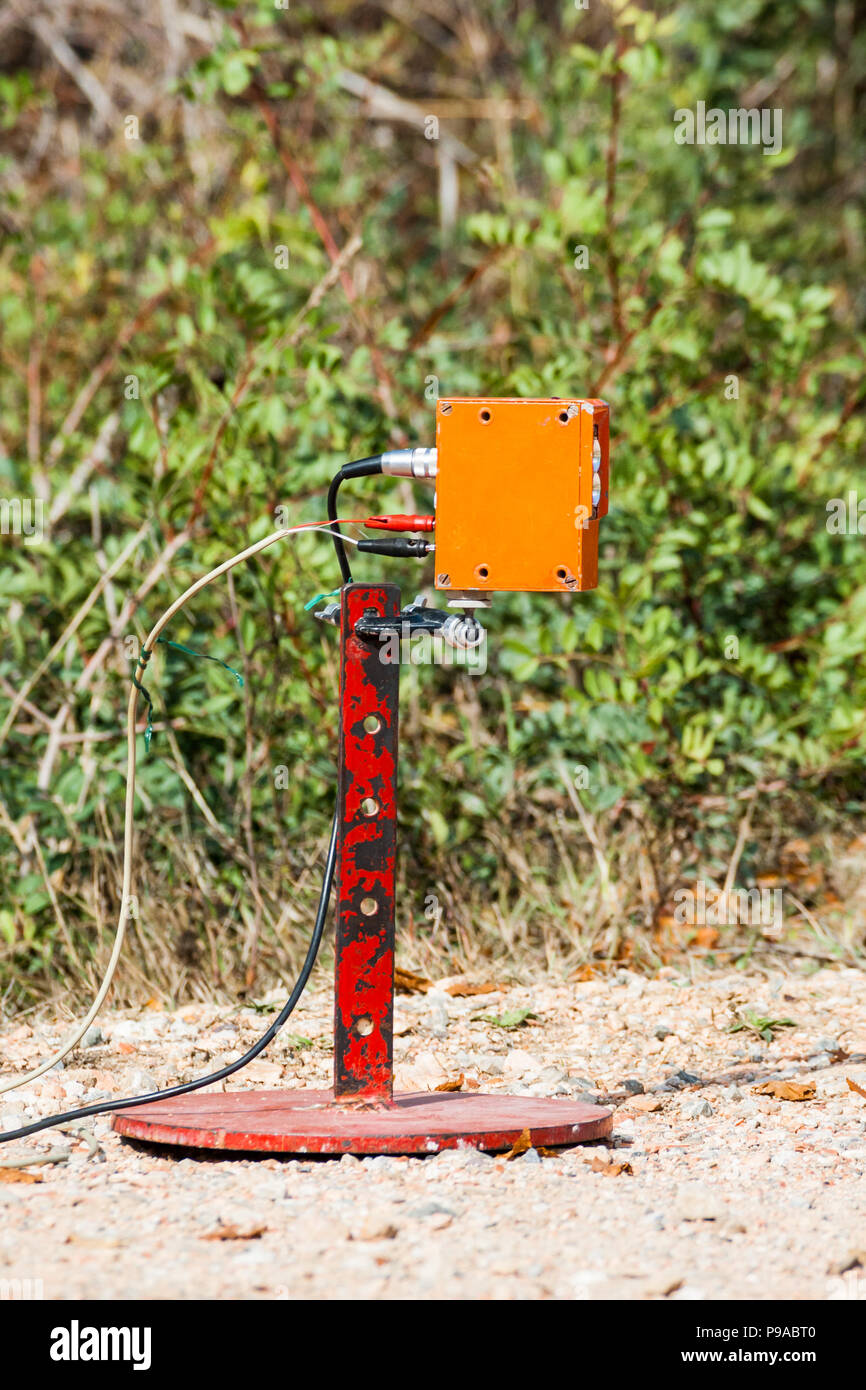 A sensor on the finishing line of a rally competition measuring arrival ...