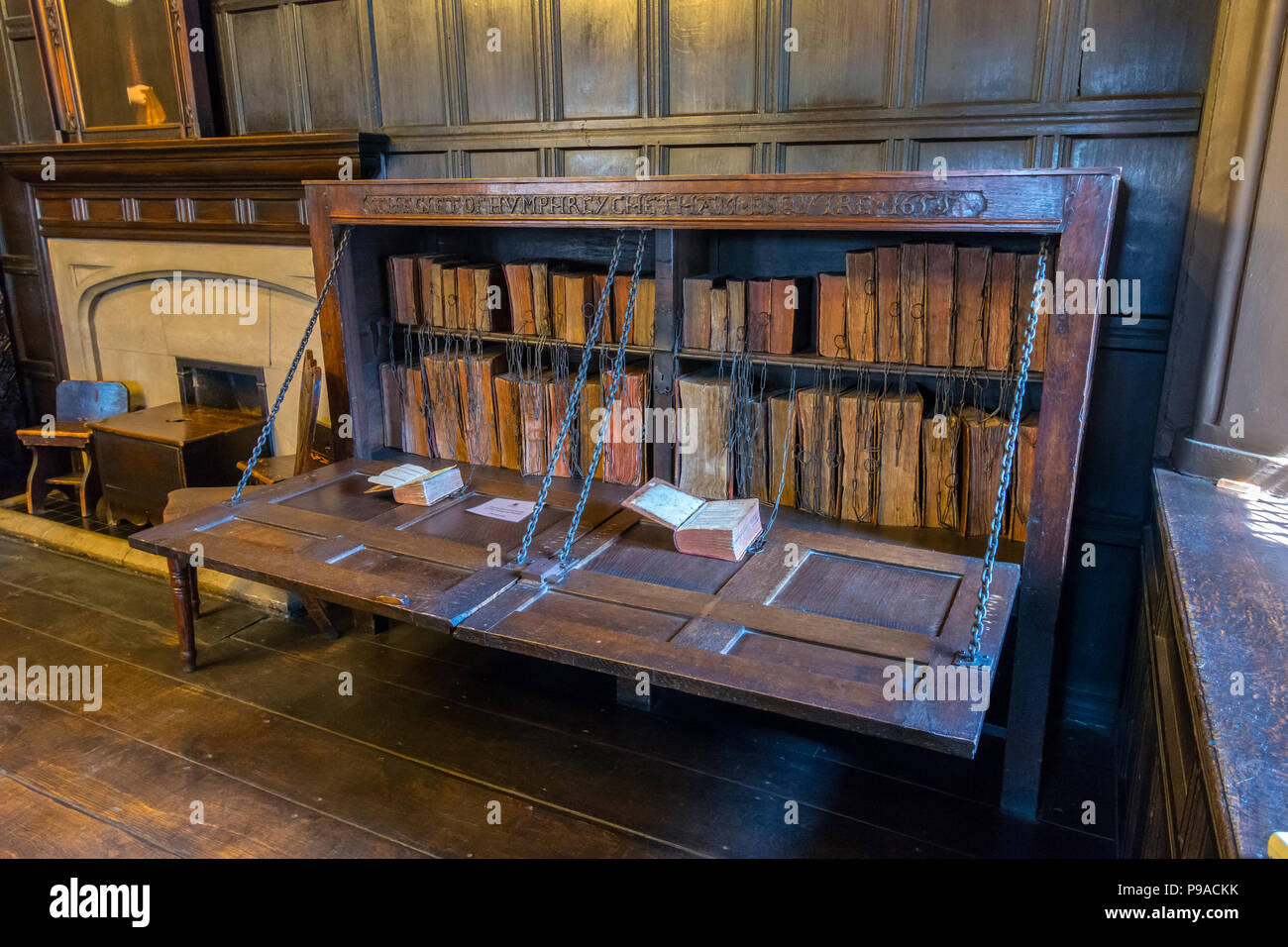 The Chained Library bookcase, dating from 1655, in the Reading Room at Chetham's Library, Manchester, England, UK Stock Photo