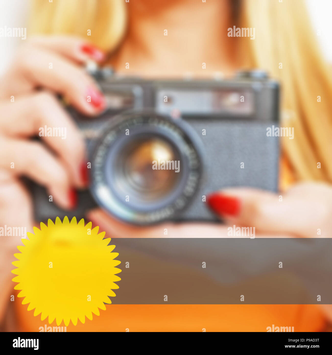 Blurred background of a woman holding a camera with web elements for advertising Stock Photo