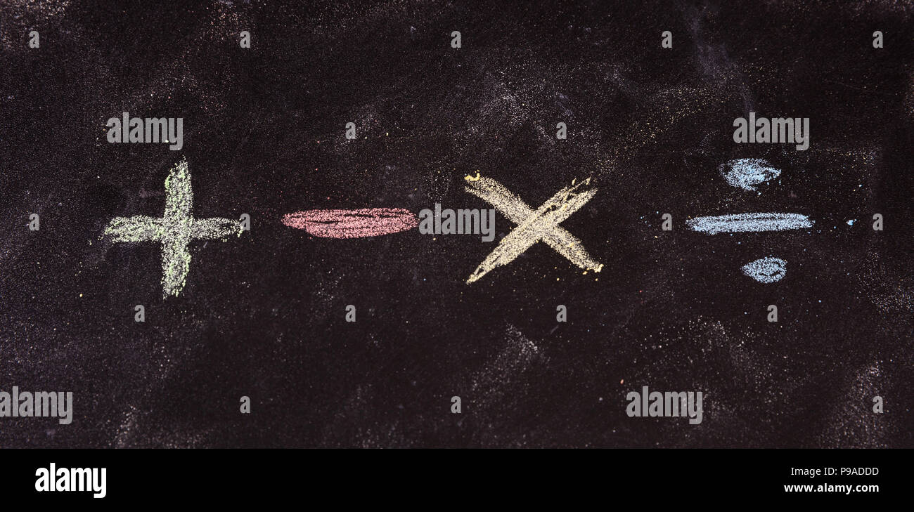 Math concept. Basic mathematical symbols written with colorful chalks ...