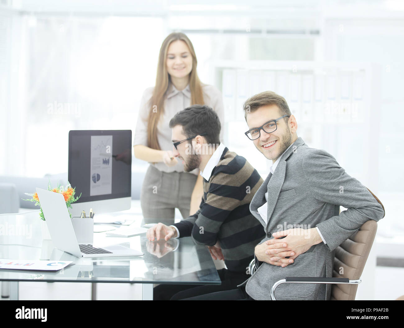successful business team in the workplace in the office Stock Photo - Alamy
