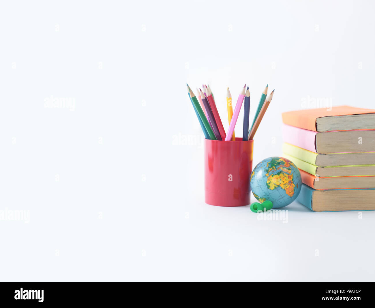 https://c8.alamy.com/comp/P9AFCP/globe-books-and-pencils-on-white-background-photo-with-copy-space-P9AFCP.jpg