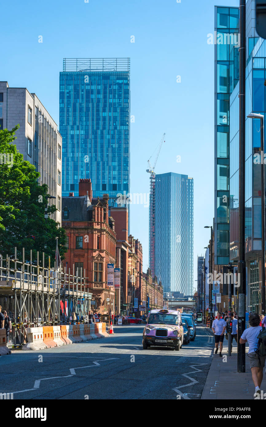 The Beetham Tower and one of the Deansgate Square apartment blocks (under construction), from Deansgate, Manchester, England, UK Stock Photo
