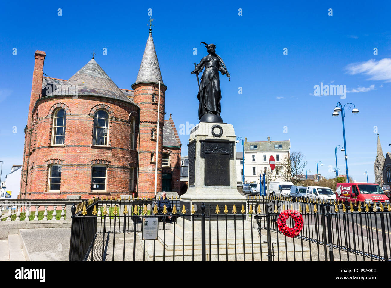 Portrush, Northern Ireland. The Great War Memorial in front of Portrush Town Hall, a fine example of Victorian municipal architecture Stock Photo