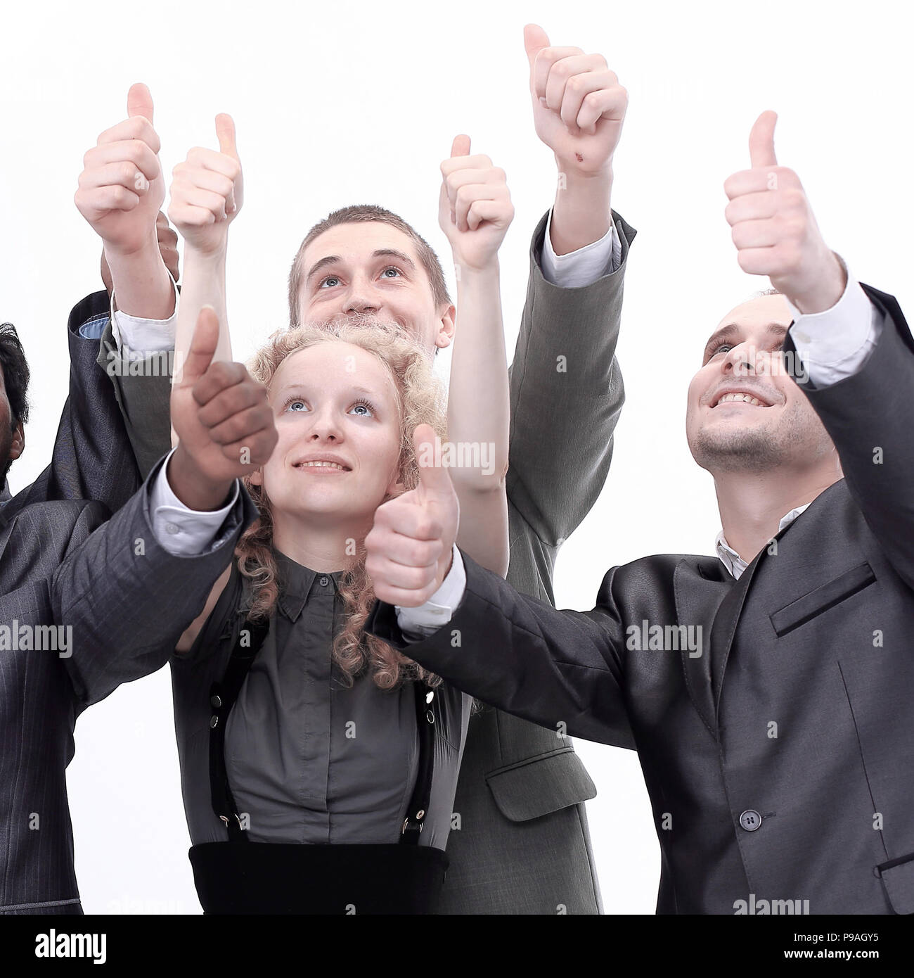 closeup.international business team showing thumbs up Stock Photo - Alamy