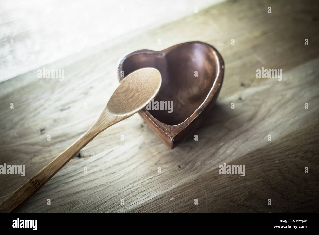 closeup. empty wooden salad bowl and wooden paddle Stock Photo Alamy