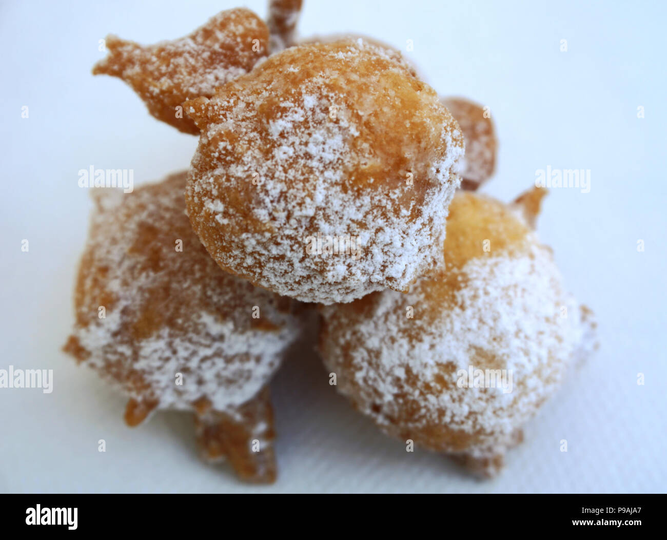 Fried dough balls with powdered sugar