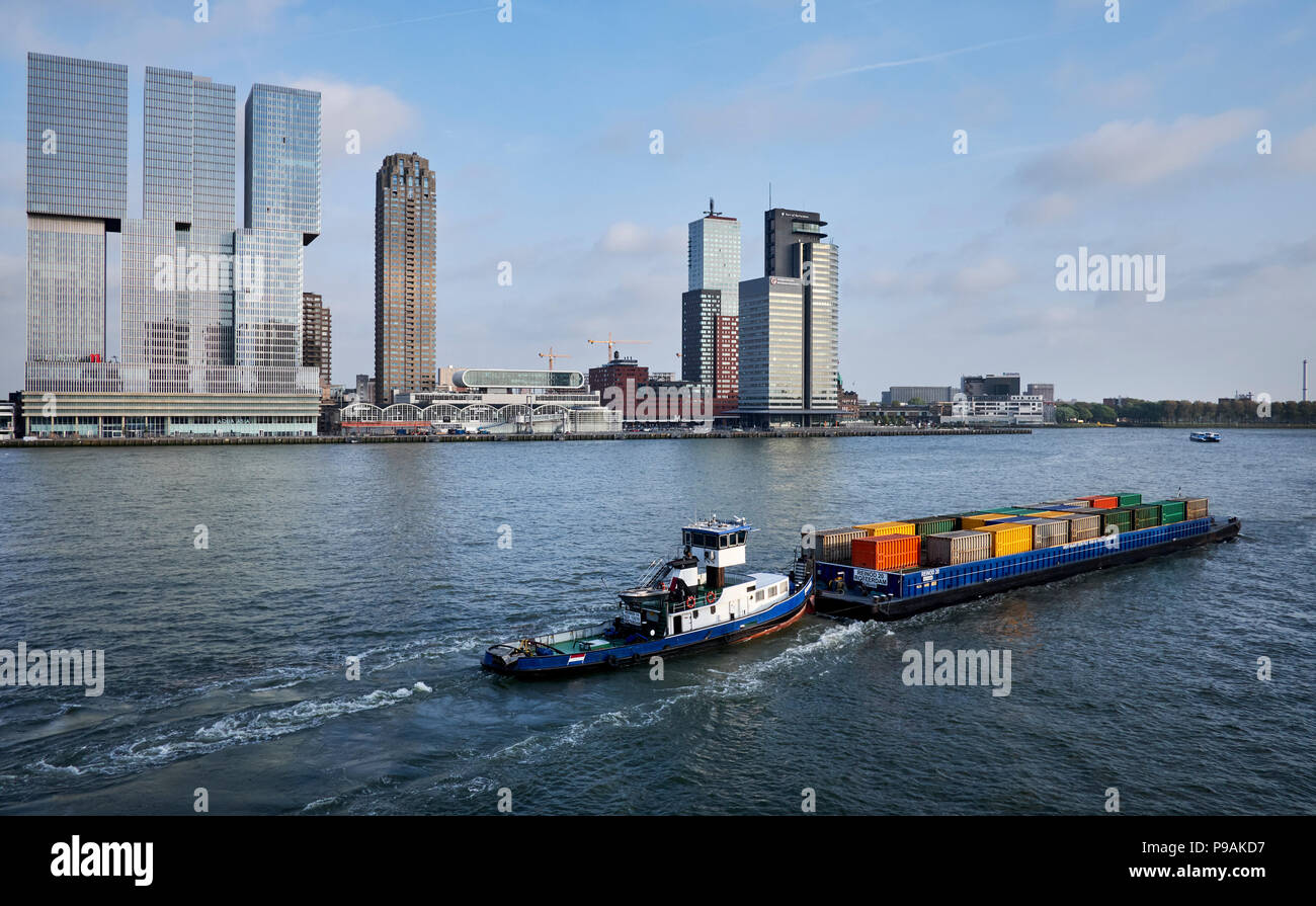Freight transport in containers by ship on the river the Nieuwe Maas in Rotterdam, Netherlands. Stock Photo