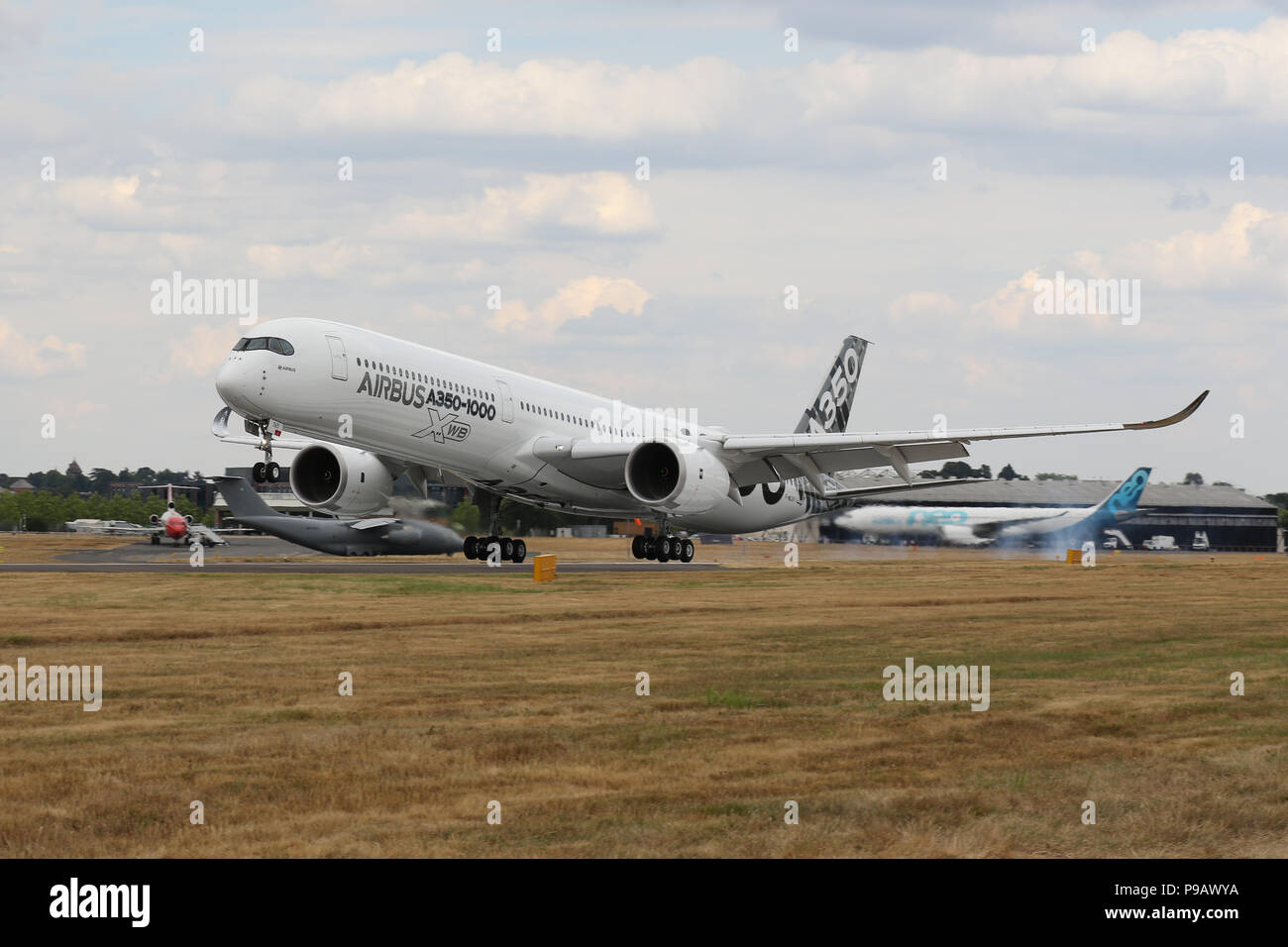 Farnborough, UK. 16th July 2018. An Airbus A350-100 XWB lands after performing its display on the opening day of the 2018 Farnborough International Airshow, one of the biggest aviation trade and industry events in the world, held in the UK. Credit: James Hancock/Alamy Live News Stock Photo