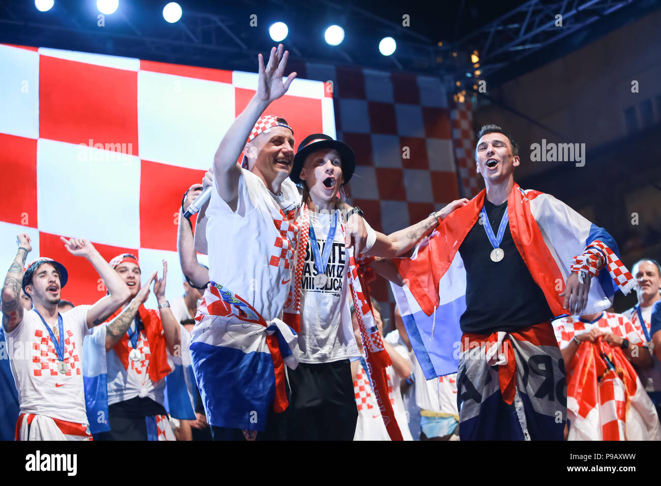 Zagreb, Croatia. 16th July, 2018. Welcome ceremony of Croatian football national team that won 2nd place, silver medal on Fifa World Cup 2018 on Ban Jelacic Square in Zagreb, Croatia. Domagoj Vida and Mario Mandzukic singing on the stage. Credit: Goran Jakuš/Alamy Live News Stock Photo