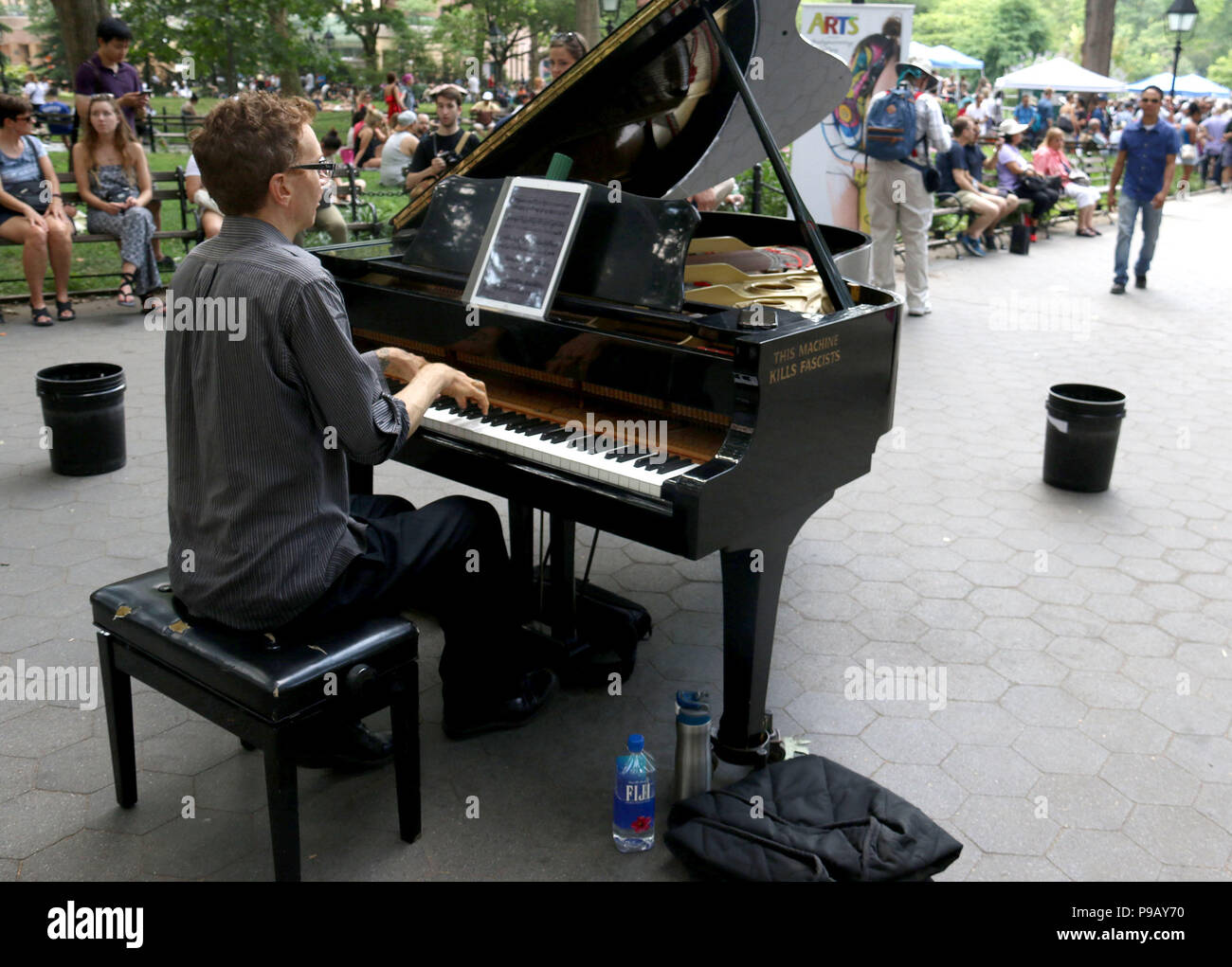 New York City New York Usa 14th July 2018 A Man Plays Gershwin S Rhapsody In Blue On The Piano With Gold Lettering With The Woody Guthrie Saying This Machine Kills Fascists Held