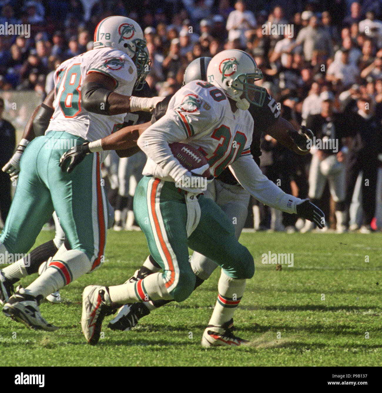 Oakland, California, USA. 1st Dec, 1996. Oakland Raiders vs. Miami Dolphins at Oakland Alameda County Coliseum Sunday, December 1, 1996. Raiders beat Dolphins 17-7. Miami Dolphins running back Bernie Parmalee Credit: Al Golub/ZUMA Wire/Alamy Live News Stock Photo