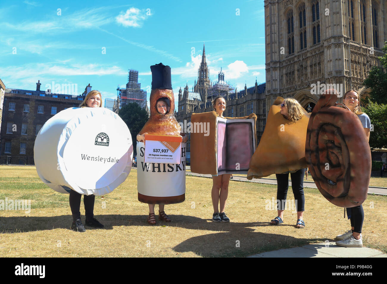 London UK. 17th July 2018 . Protesters dressed as Scotch Whisky, Cornish pasty, Wensleydale cheese, Cumberland sausage and Melton Mowbray pork pie from 38 Degrees People Power Change, a British not-for-profit political outside Parliament who champion the power of ordinary people with a petition  not to lock the public out of trade deals in Brexit talks and  Trade is too important to be done in secret voicing concerns that  all post-Brexit trade deals are accountable and transparent and consulting the public to make sure trade deals work for everyone Credit: amer ghazzal/Alamy Live News Stock Photo