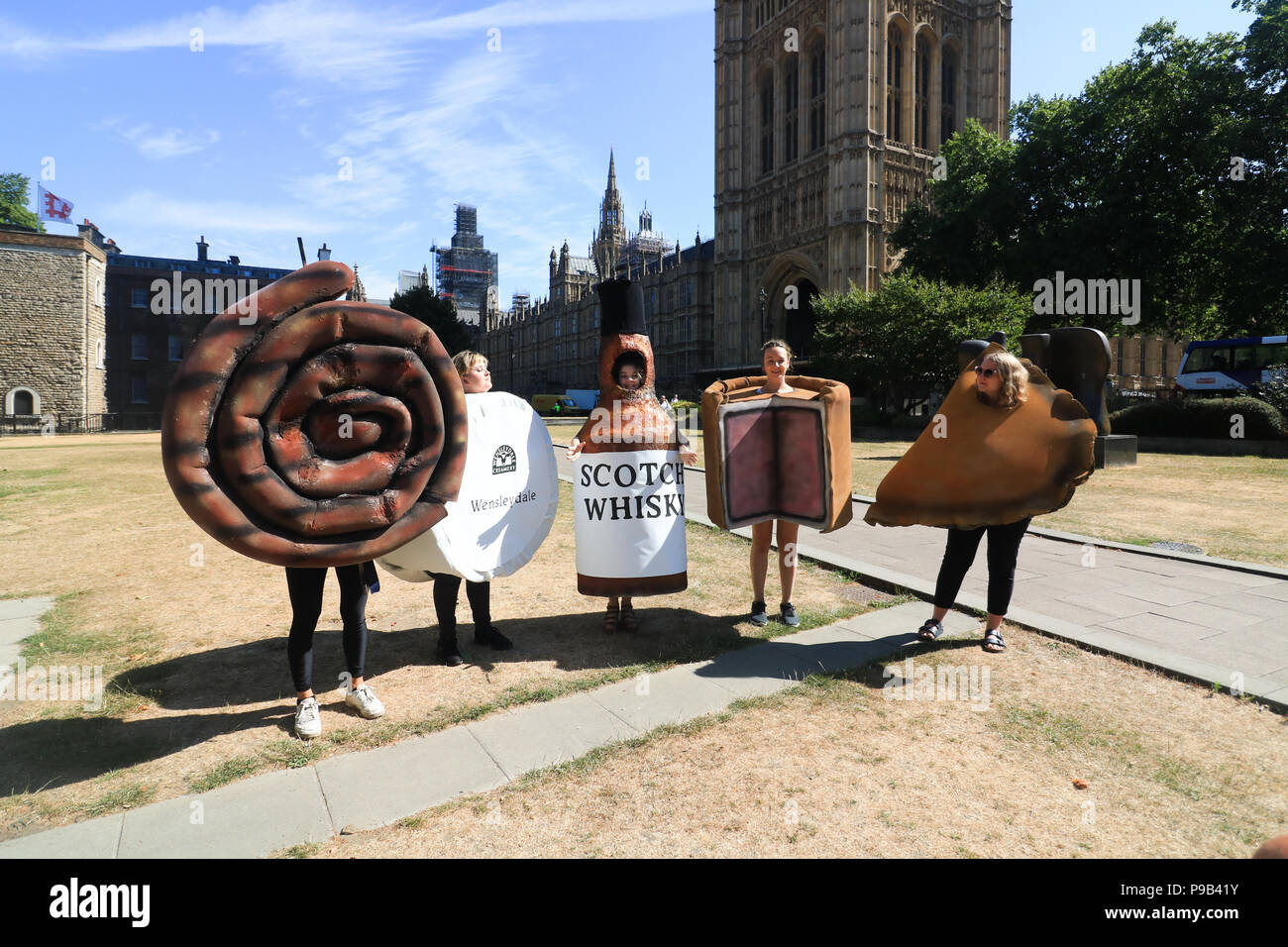 London UK. 17th July 2018 . Protesters dressed as Scotch Whisky, Cornish pasty, Wensleydale cheese, Cumberland sausage and Melton Mowbray pork pie from 38 Degrees People Power Change, a British not-for-profit political outside Parliament who champion the power of ordinary people with a petition  not to lock the public out of trade deals in Brexit talks and  Trade is too important to be done in secret voicing concerns that  all post-Brexit trade deals are accountable and transparent and consulting the public to make sure trade deals work for everyone Credit: amer ghazzal/Alamy Live News Stock Photo