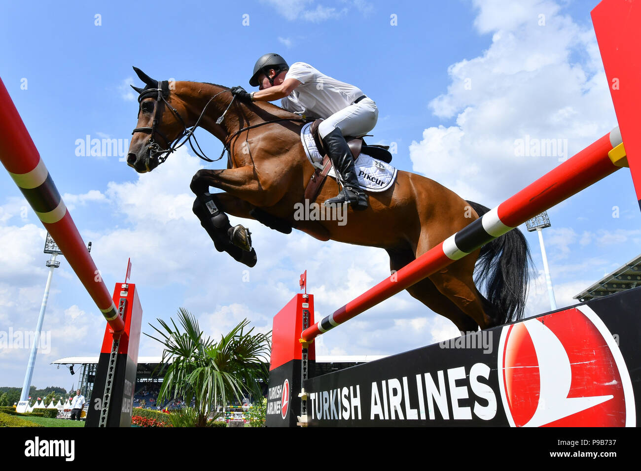 Aachen, Germany. 17th July, 2018. CHIO, equestrian, jumping. The German rider Markus Beerbaum on the horse Cool Hand Luke jumps over an obstacle during the opening jumping. Credit: Uwe Anspach/dpa/Alamy Live News Stock Photo