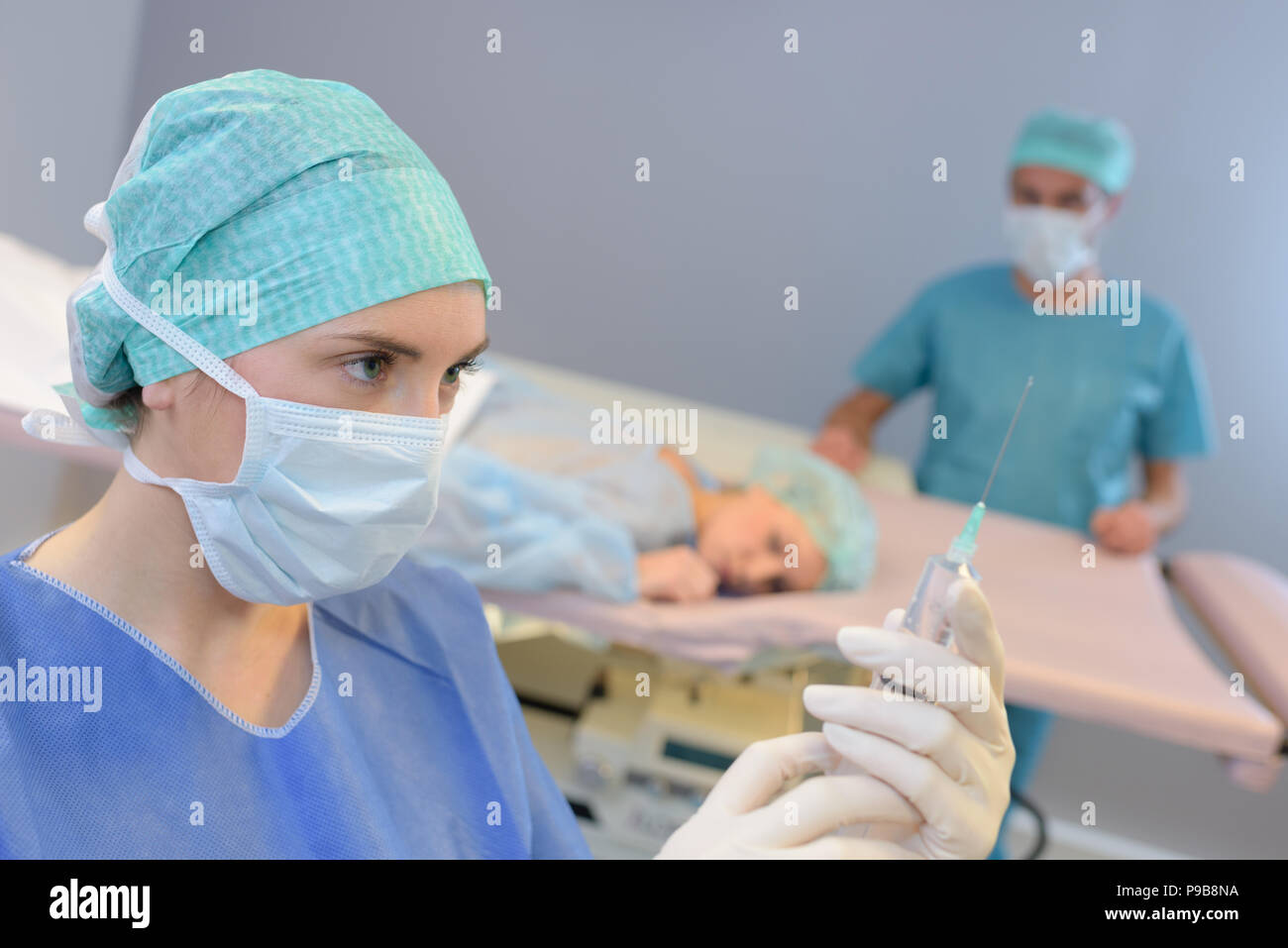 Female nurse preparing medication injection hi-res stock photography ...