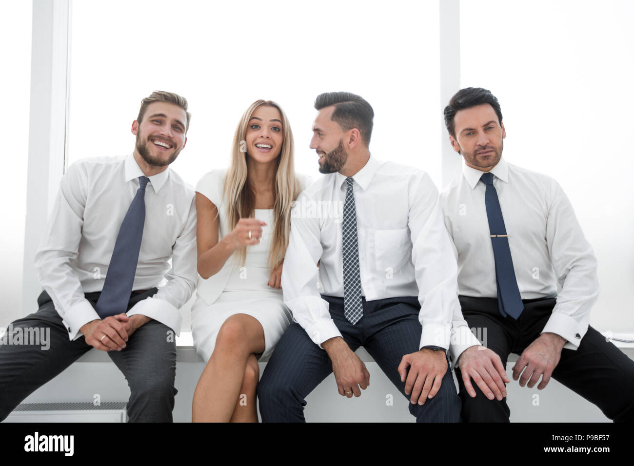 close up.successful business team sitting in a row Stock Photo - Alamy