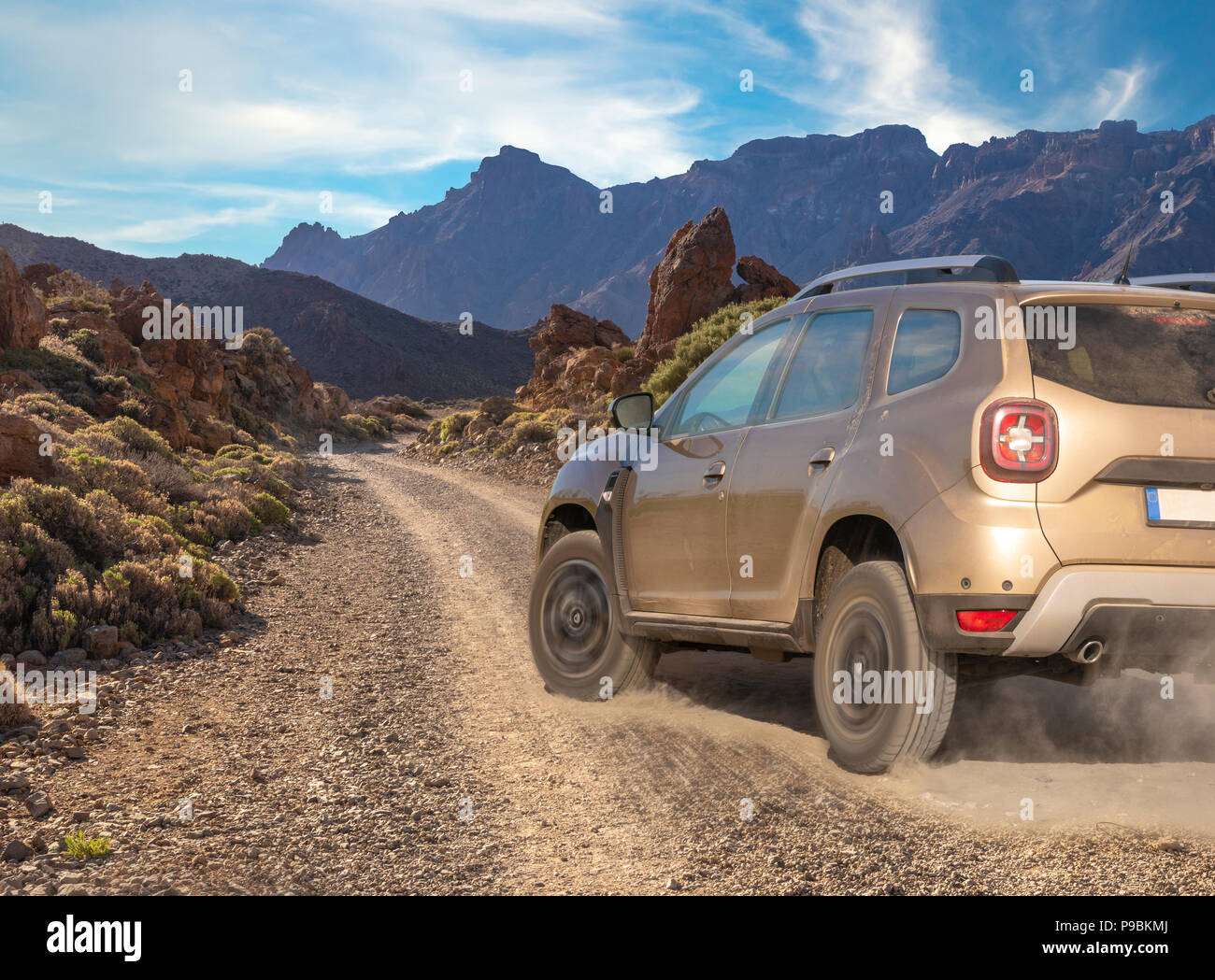 SUV driving dynamically on off-road terrain Stock Photo
