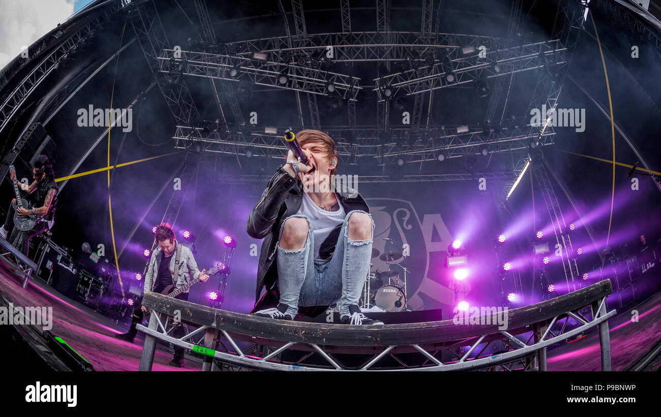 British Metal Core band Asking Alexandria on stage at the 2015 Copenhell Metal festival. In the foreground vocalist Denis Stoff Stock Photo