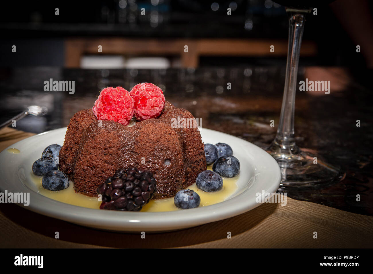 Molten Lava Cake with Fruit and Syrup Stock Photo