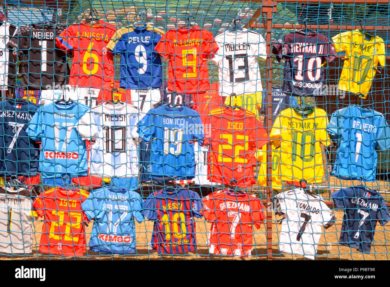 Football shirts for display at market stall - likely all are knock off copies of the originals Stock Photo