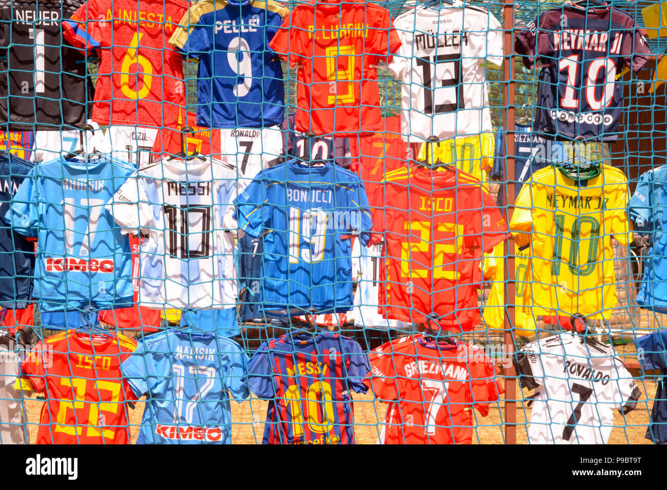 Football shirts for display at market stall - likely all are knock off copies of the originals Stock Photo