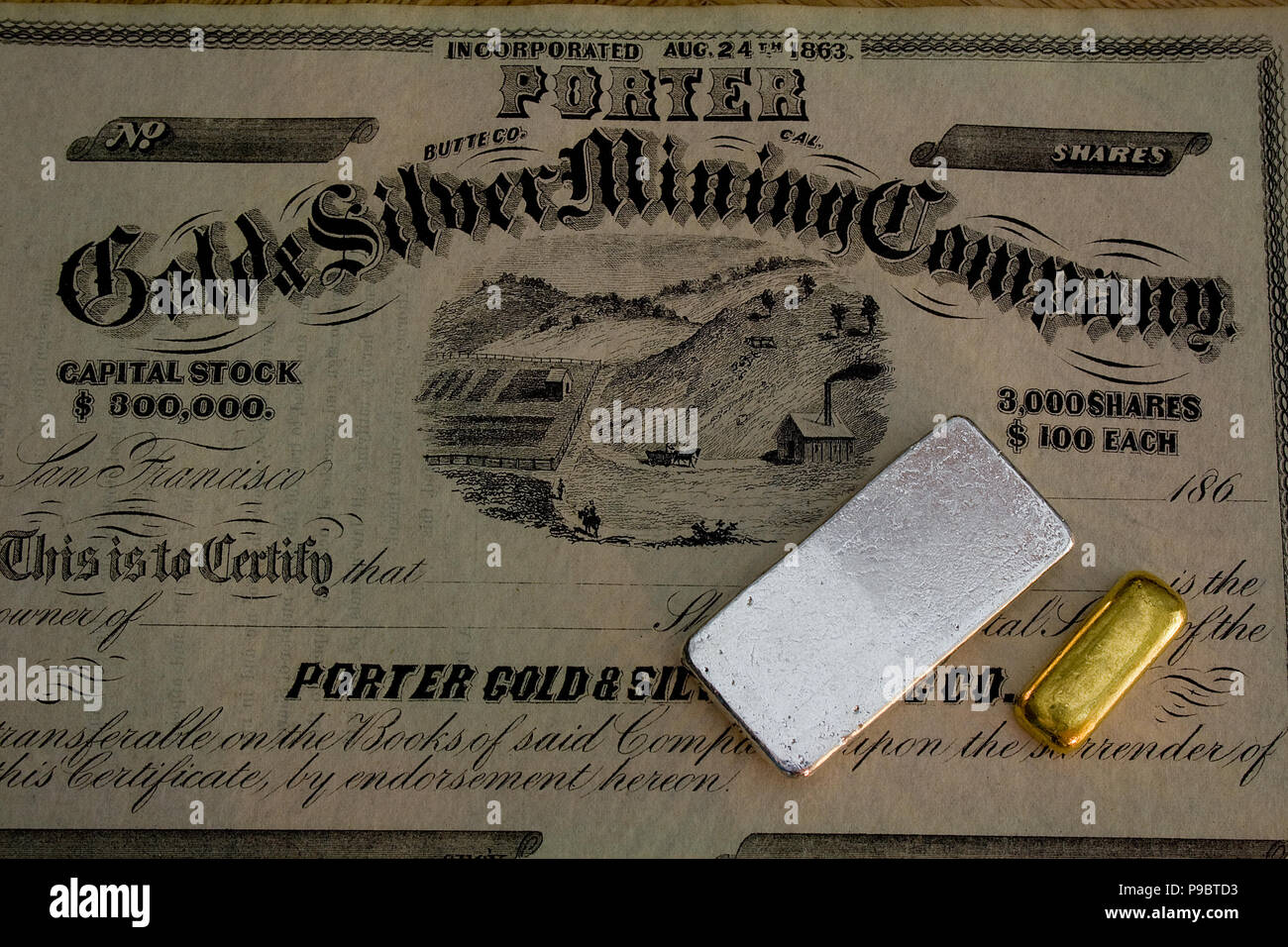 Authentic 1860s Porter Gold and Silver Mining Company stock certificate -  California. Genuine gold and silver bars also shown. Stock Photo