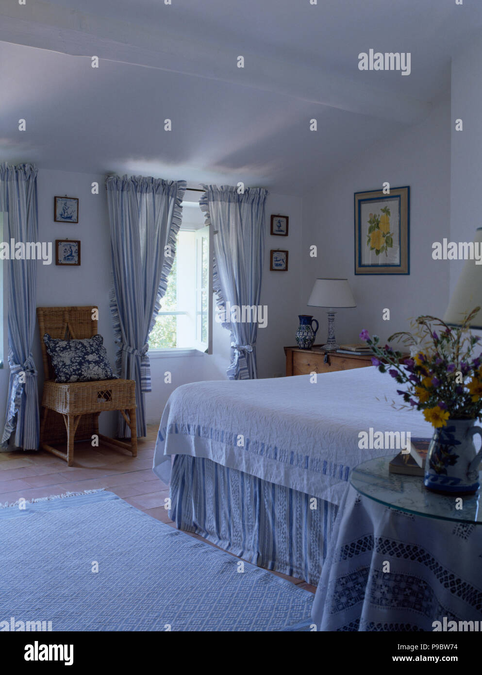 Blue And White Striped Curtains On Window In White Country Bedroom