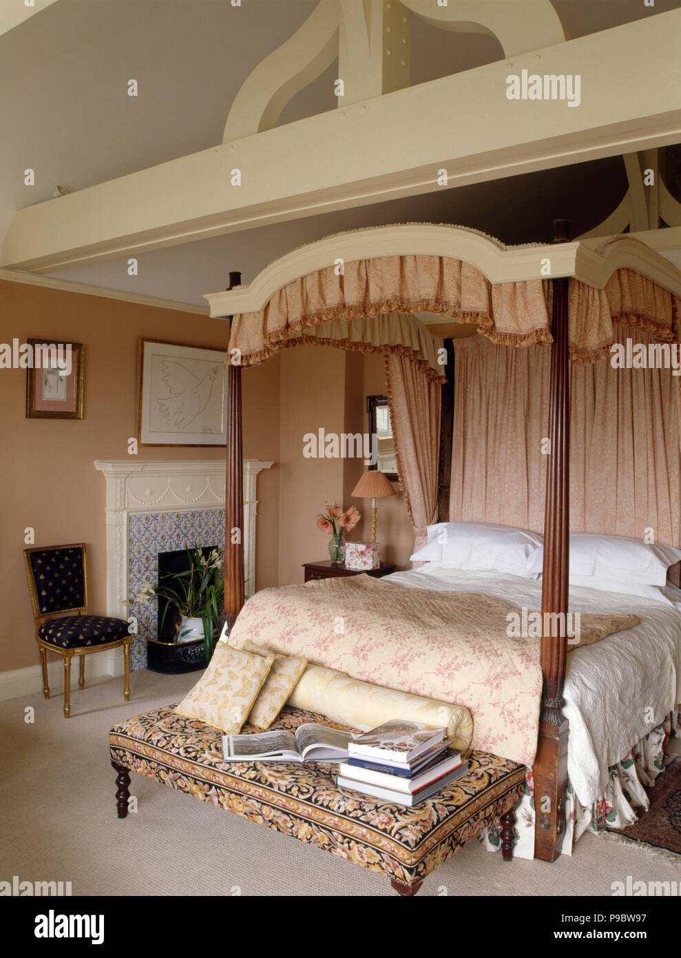 Pale Pink Drapes And Quilt On A Four Poster Bed In A Large Country