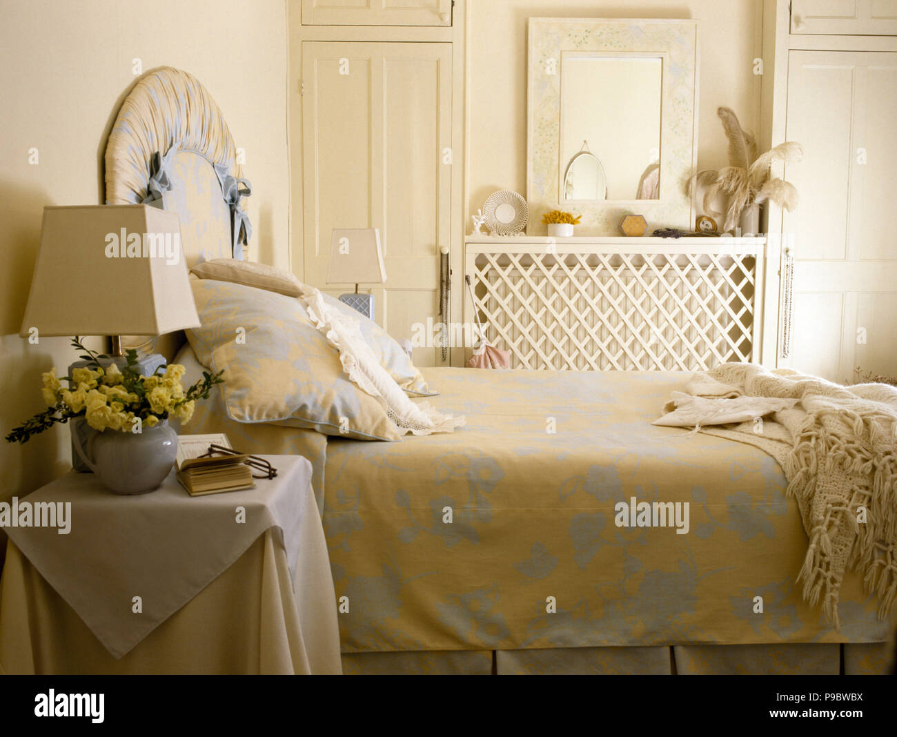 Floral linen on bed in eighties bedroom Stock Photo