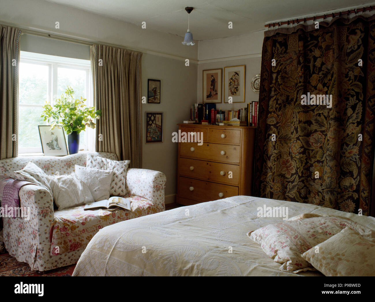 Small sofa in eighties cottage bedroom Stock Photo