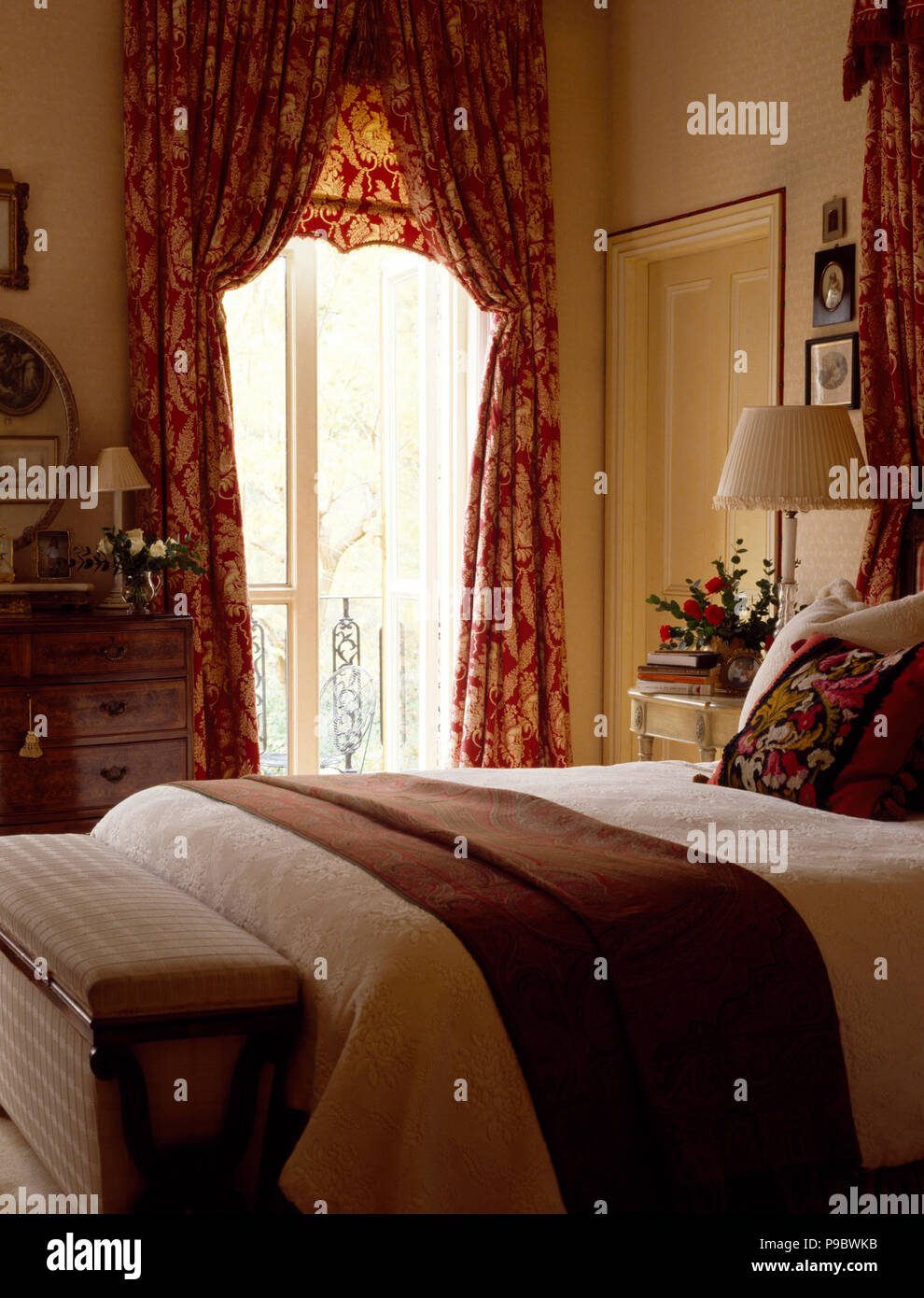 Brown Throw And Cream Bedspread On Bed In Townhouse Bedroom