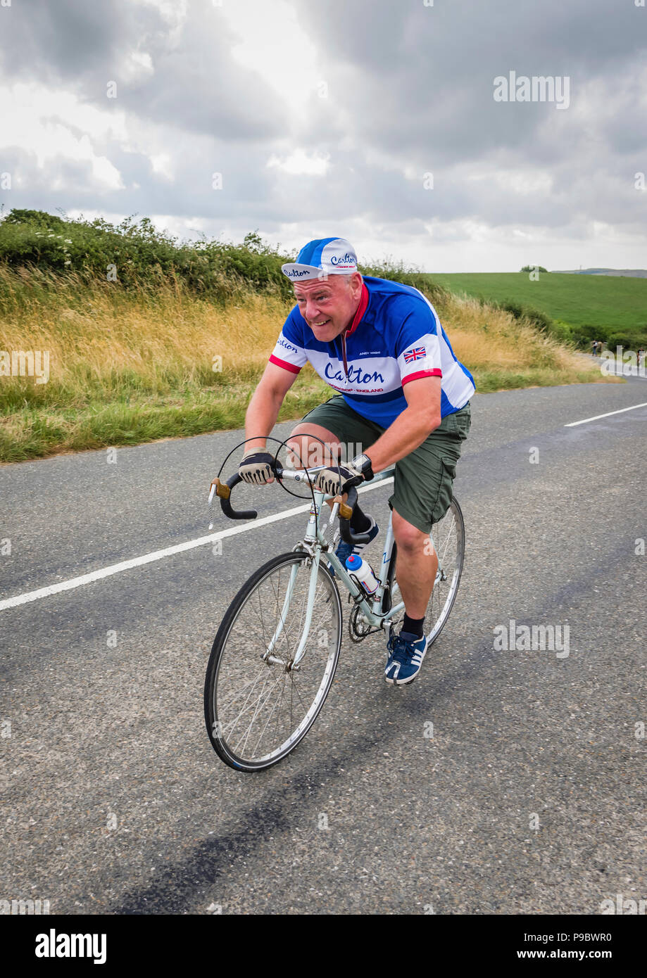 Mature male cyclist taking part in a vintage cycling event. Stock Photo