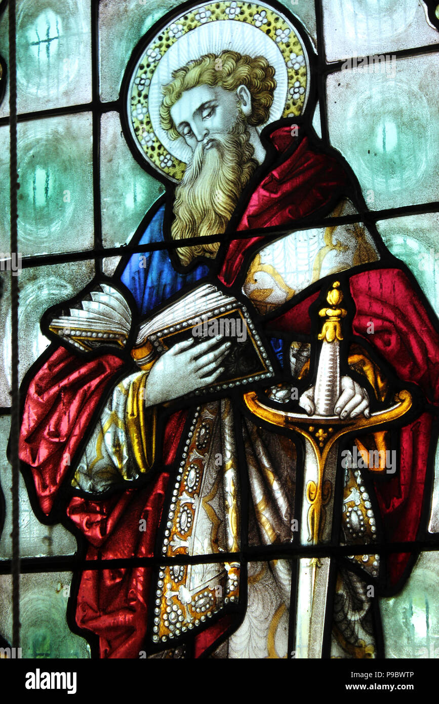 Saint Paul, holding a large sword and reading a book. Stock Photo