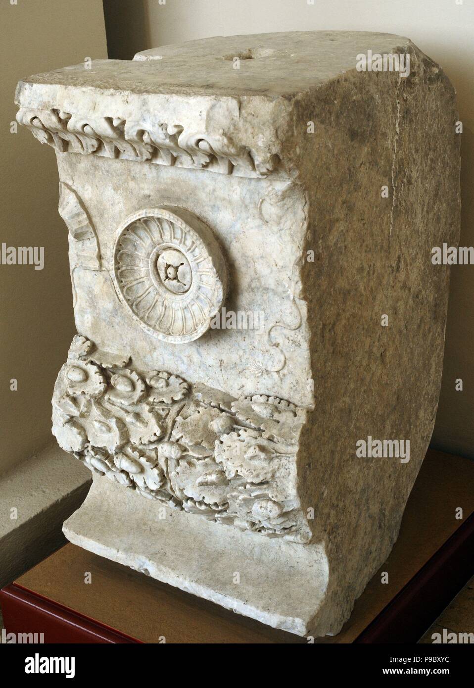 Fragment of frieze. Marble. 1st century A.D. Decorated with garlands, ribbons and umilicata patera. Forum of Tarragona. National Archaeological Museum. Tarragona. Catalonia, Spain. Stock Photo