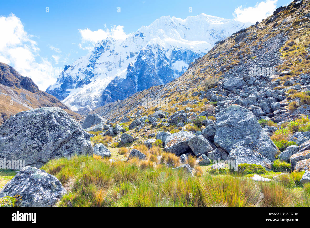 Scenic view of Salkantay snowy Andean mountain, rocky path from a trek to Machu Picchu . Stock Photo