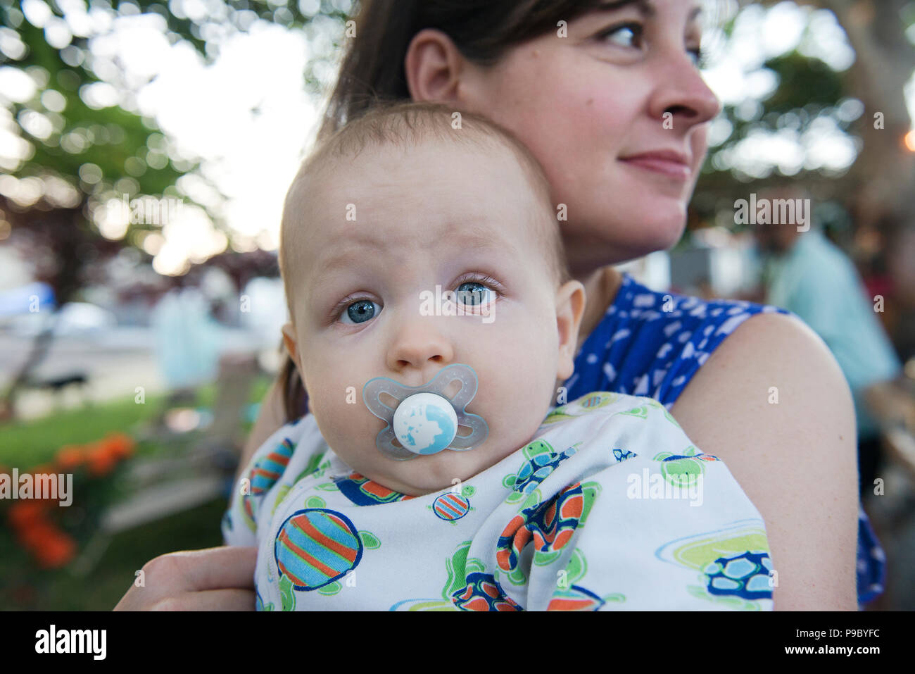 A baby with a pacifier. Stock Photo