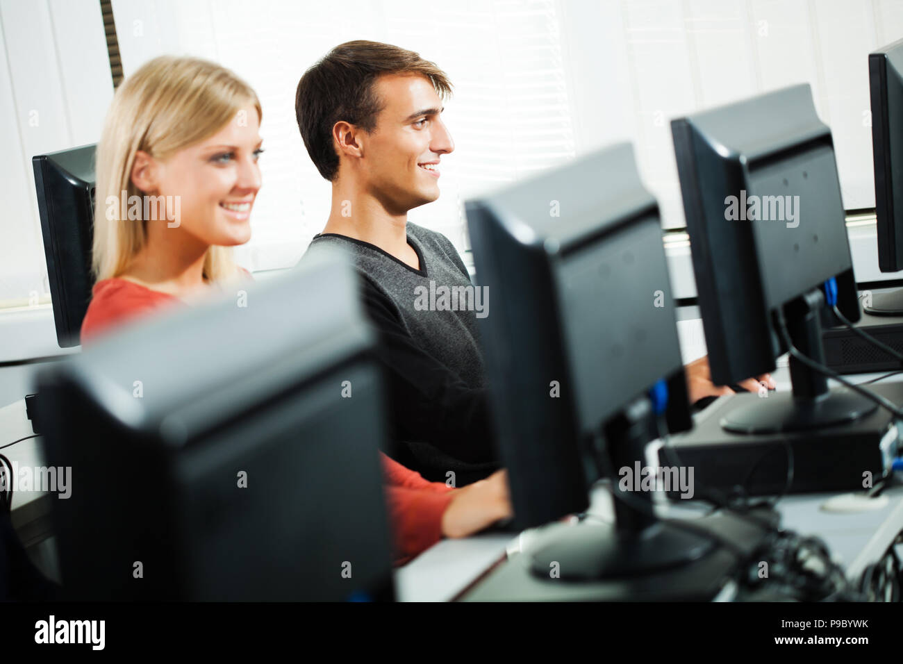 Students learning in computer lab Stock Photo - Alamy