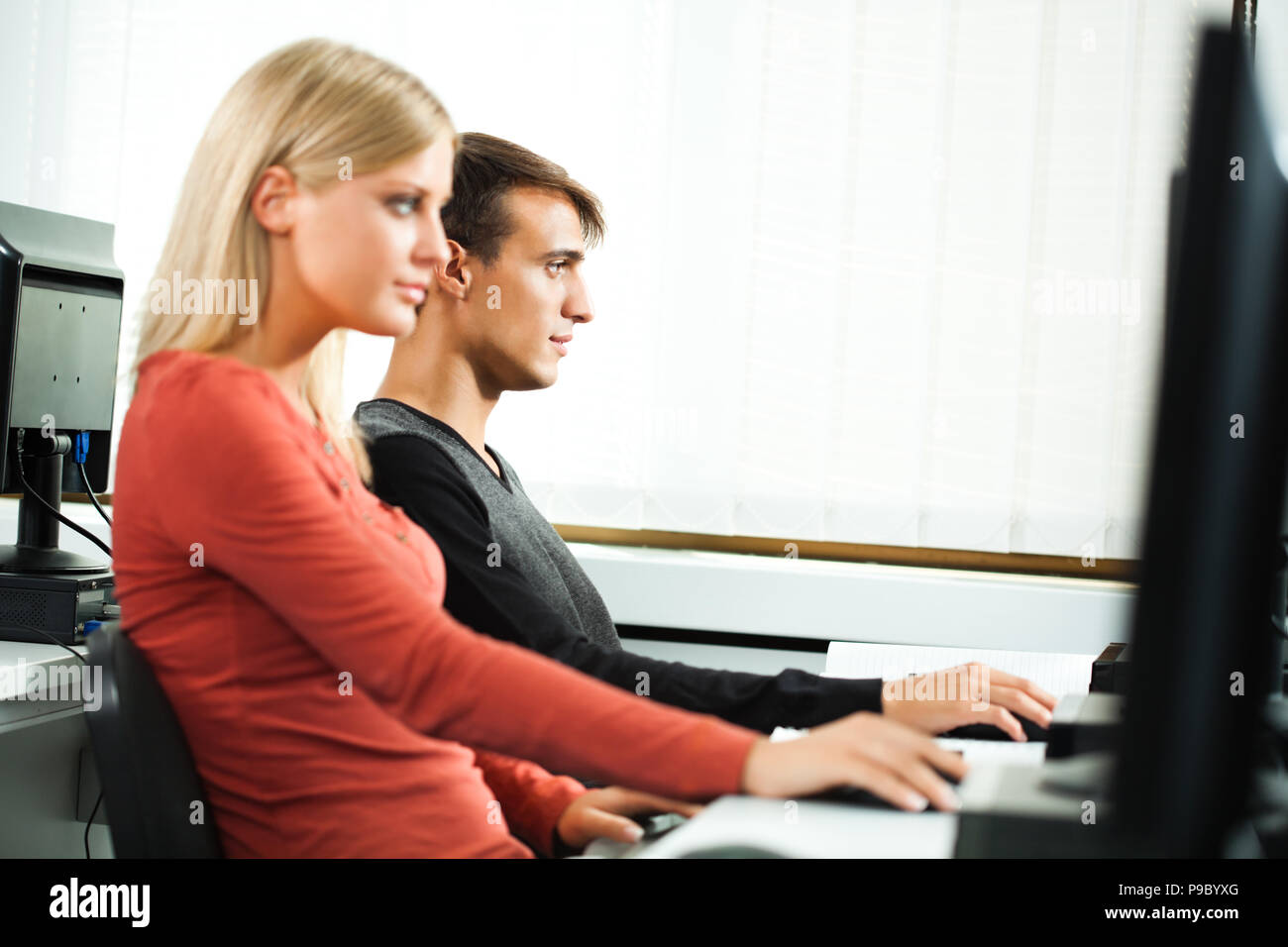 Students learning in computer lab Stock Photo