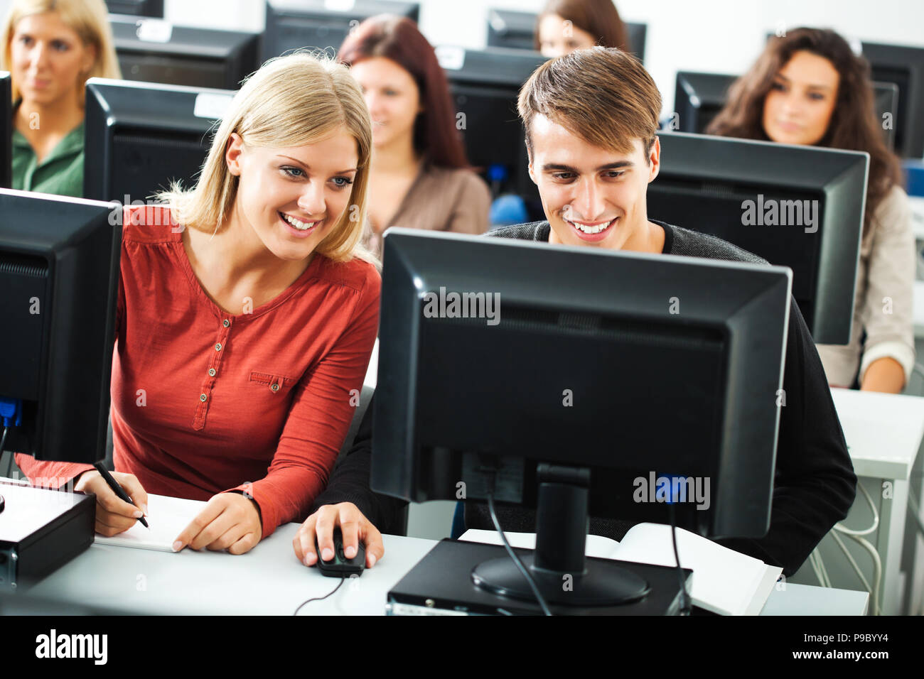Students learning in computer lab Stock Photo - Alamy