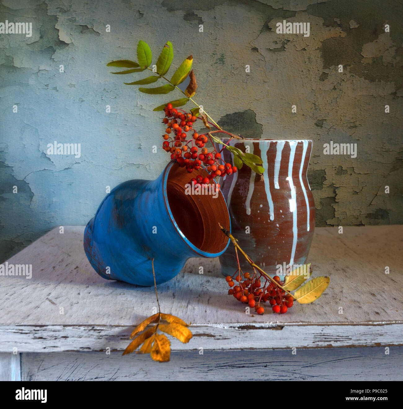 still life with vases and clusters of mountain ash. vintage. Stock Photo