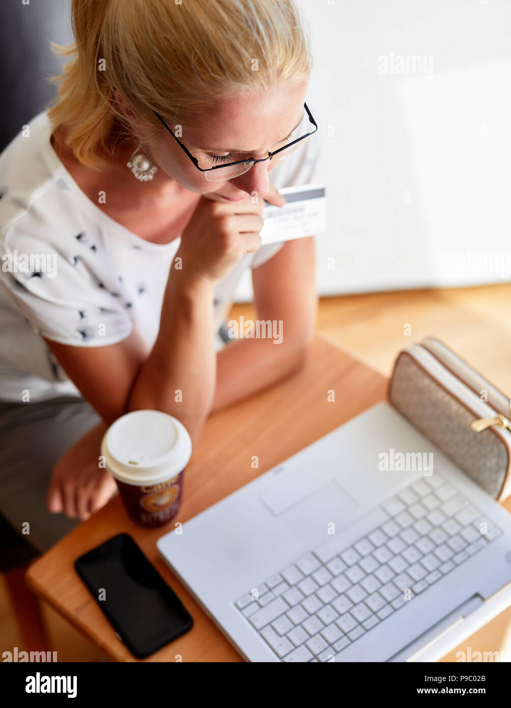 Woman using laptop online Stock Photo