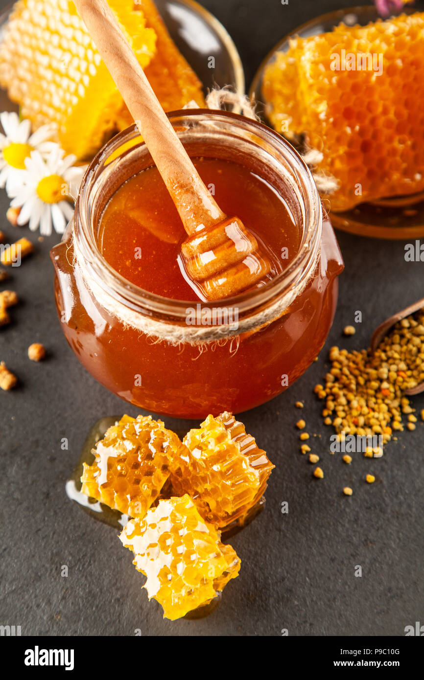 Honey jar and dipper Stock Photo Alamy
