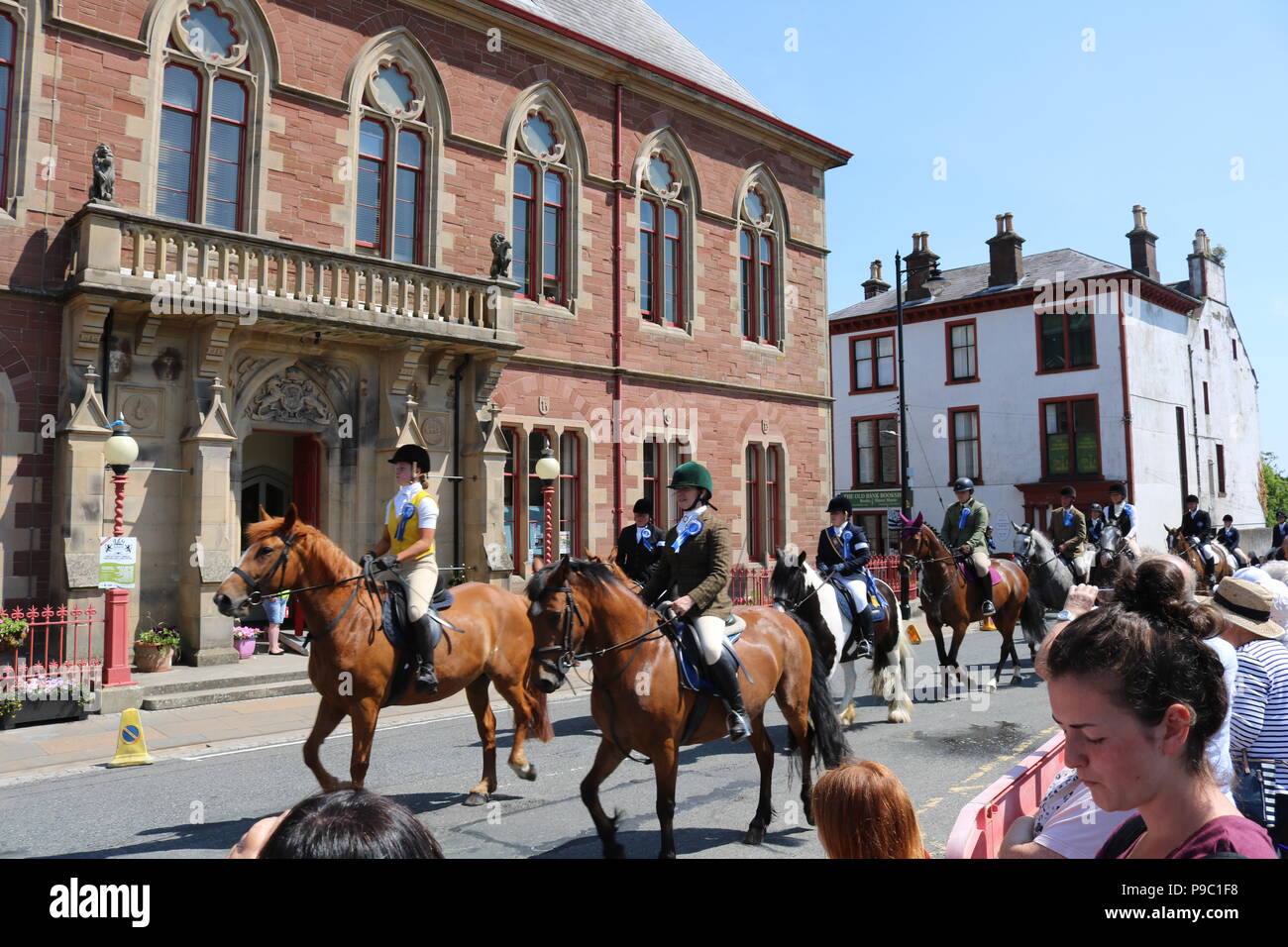 Horse riders setting off in front of the town hall to do the Riding of the Marshes in Wigtown, Newton Stewart, Dumfries and Galloway Stock Photo