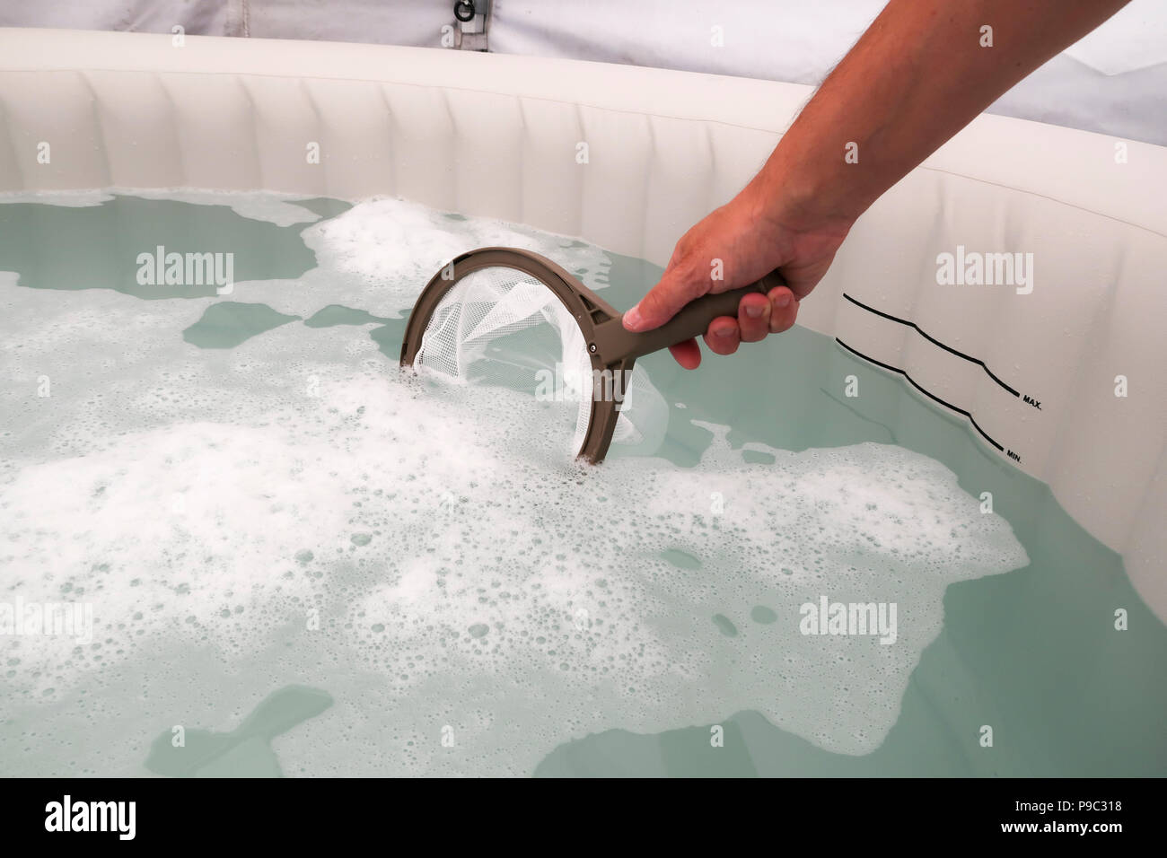 Skimming inflatable hot tub water Stock Photo