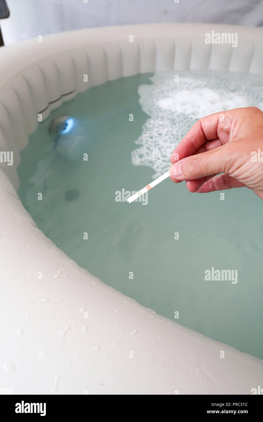 Water test strips used in jacuzzi Stock Photo