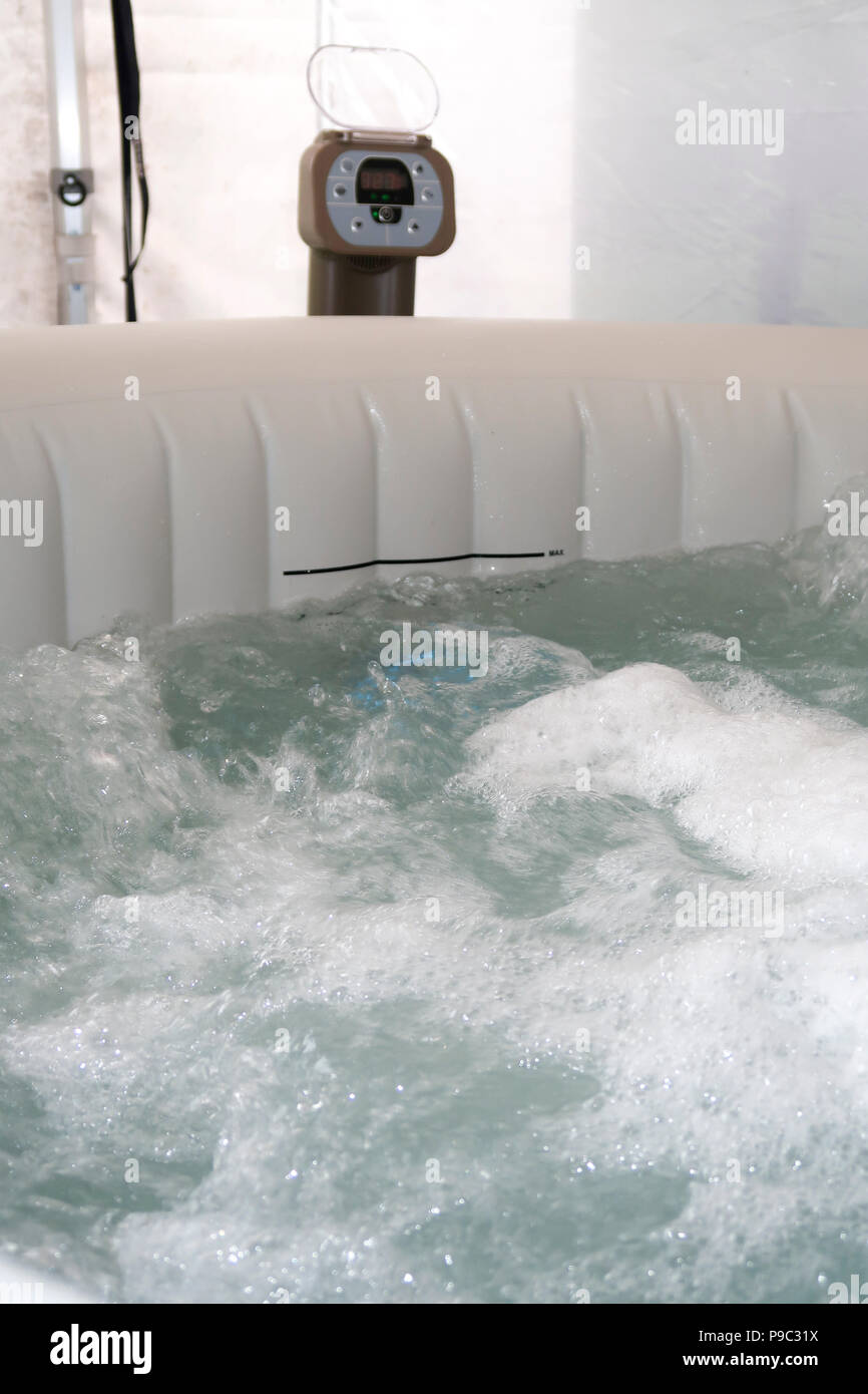 Inflatable hot tub in garden gazebo Stock Photo Alamy