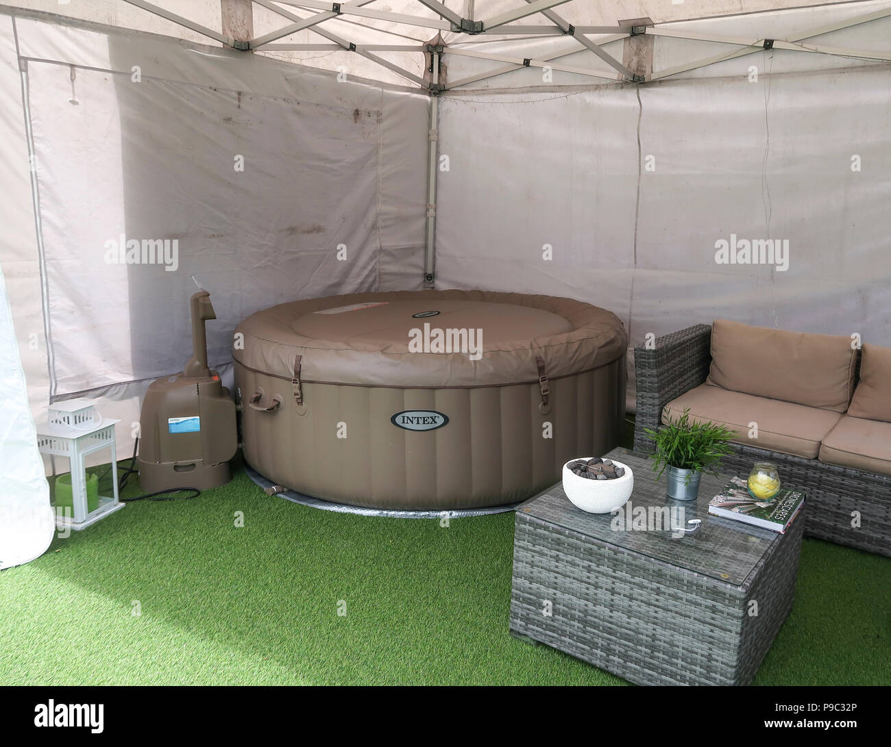 Inflatable hot tub in garden gazebo Stock Photo Alamy