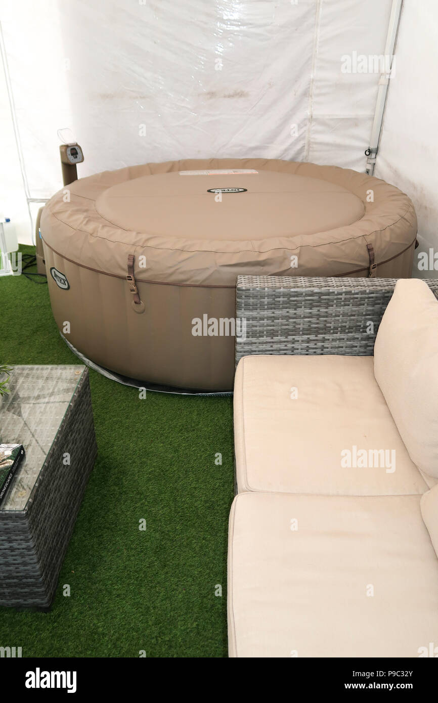 Inflatable hot tub in garden gazebo Stock Photo Alamy