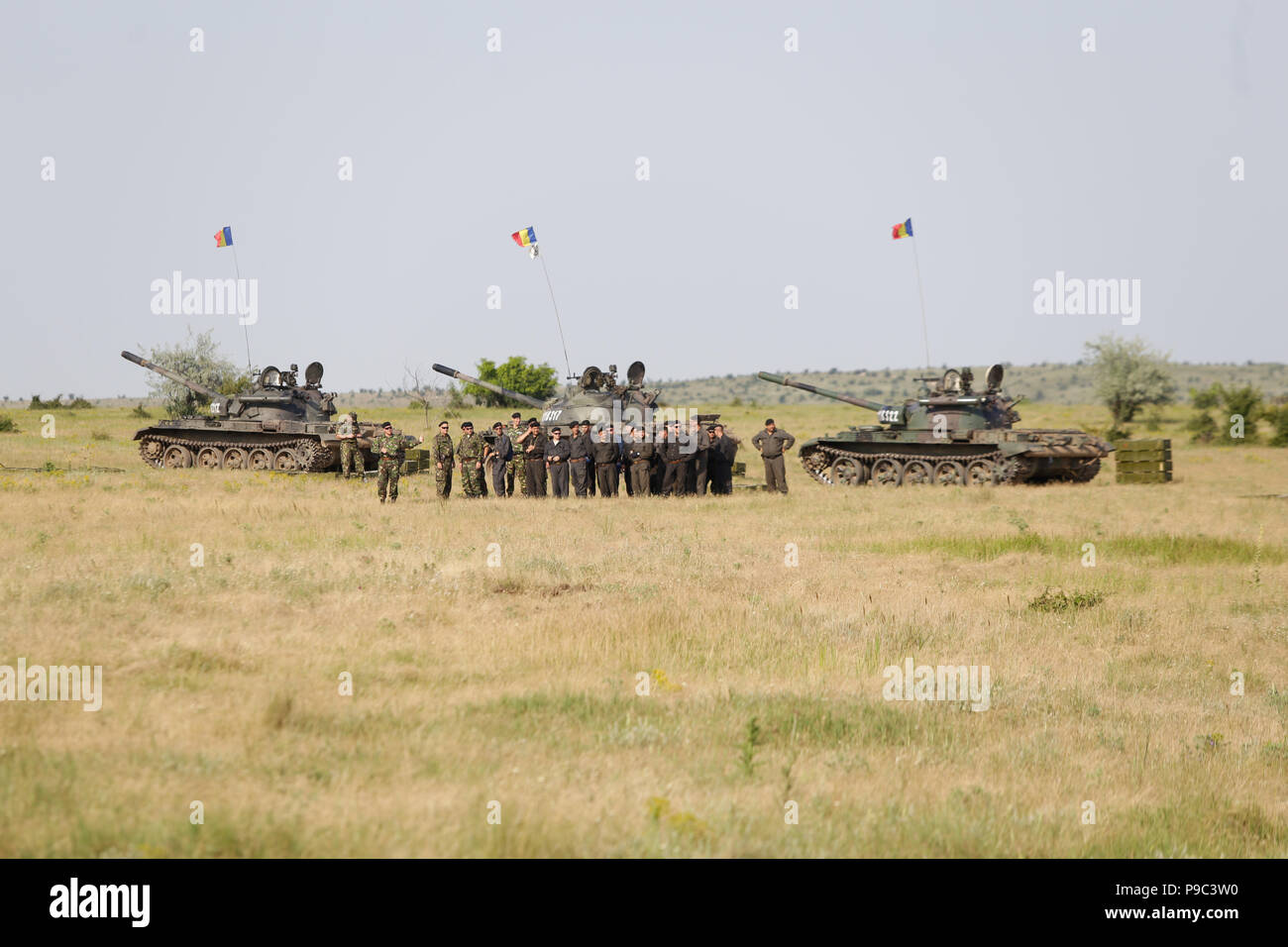 BABADAG, ROMANIA - JUNE 23, 2018: Romanian soldiers near Russian made T-55 light tanks, during a drill Stock Photo